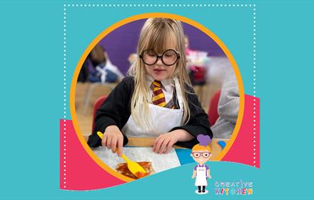 Child dressed in Harry Potter fancy dress in the Magical Wizarding Workshop