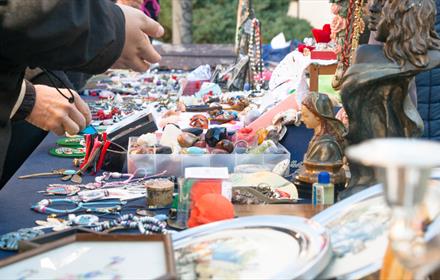 customers next to nick-nacks and jewellery market stall