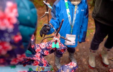 Children in Hamsterley Forest searching for stick characters on The Stickman Man Trail. Credit Forestry England Crown Copyright