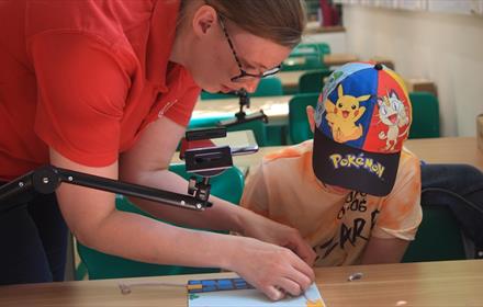 Adult and child partaking in a Stop Motion Animation workshop.