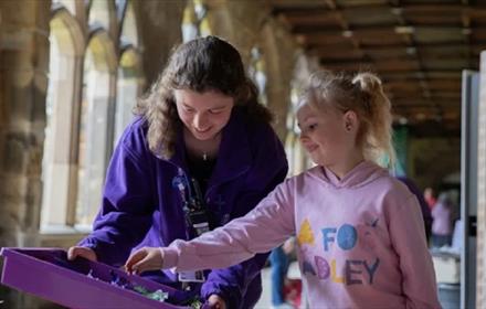 Two children taking part in family activities at Durham Cathedral