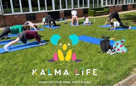 People doing Yoga outside in the sunshine
