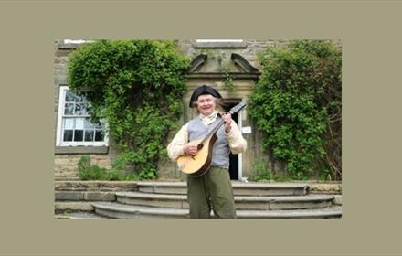 A man dressed on Folk costume at Beamish Museum.