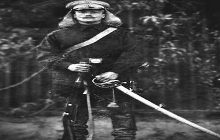 Black and white photo of a soldier in uniform, with weapons - Bowburn Medal and Militaria Fair