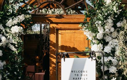 Doorway surrounded by white flowers