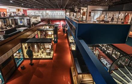 Birdseye view of people browsing the Oriental Museum galleries.