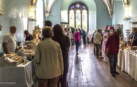 People enjoying Brancepeth Castle Christmas craft fair.