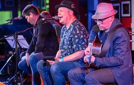 Jimmy Regal and The Royals performing on stage.