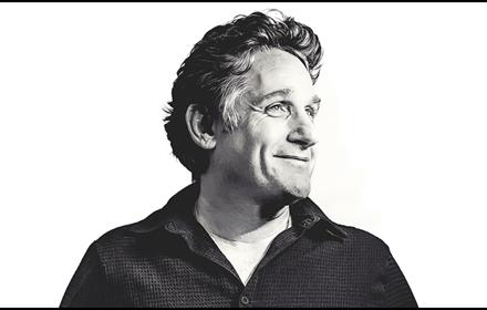 Black and white photo of Tom Stade looking off to the left.