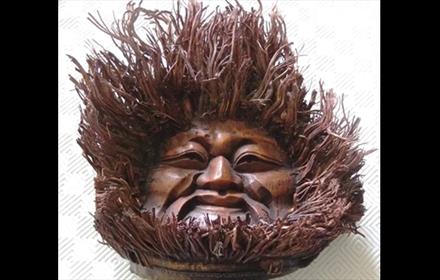 A face carved from wood
