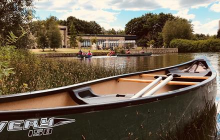 Exterior shot of boats on the lake outside The TCR Hub