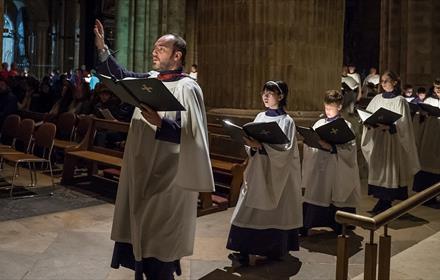 The sound of the Vespers for Christmas sung in half-light by the Cathedral's Lay Clerks and Choral Scholar