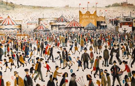 Lowry painting of crowds at a fairground.