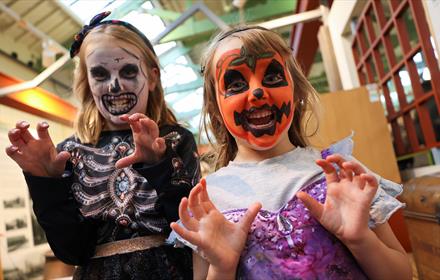 Two children in Halloween costumes, with painted faces at Hopetown Darlington.