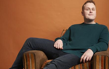 Josh Jones reclining in a chair