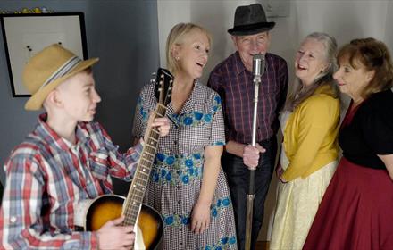 Band members performing together - 'Hop Skiffle Jump'