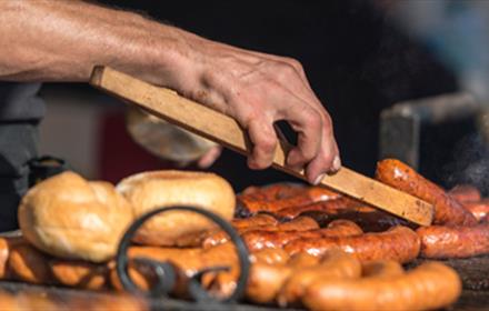 Sausages on the BBQ at Lumley Castle Tipi