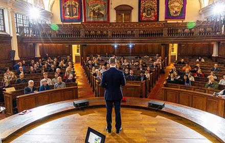 Pitman's Parliament DEI Conference. Speaker addressing audience at Redhills Durham Miners Hall