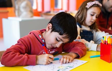 A child enjoying colouring activities at The Bowes Museum  ©TheBowesMuseum