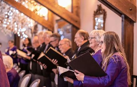 Christmas Choir performing at South Causey Inn.
