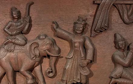 A wooden carving of a scene from the Ramayana.