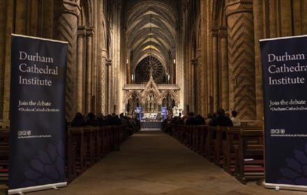 Banners which read, 'Durham Cathedral Institute' on either side of the Nave at Durham Cathedral