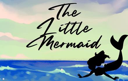 The Little Mermaid - Silhouette of Ariel over the sea.