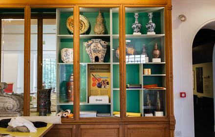 Cabinet showing a variety of ceramics.