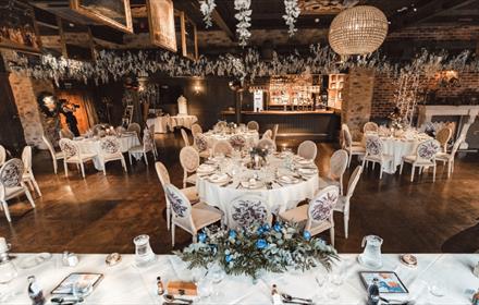 Bowburn Hall Hotel - tables staged for a wedding, with beautiful floral centre pieces.