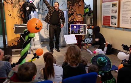 Children watching BIg Science's Spooktacular Halloween Show at Hopetown.