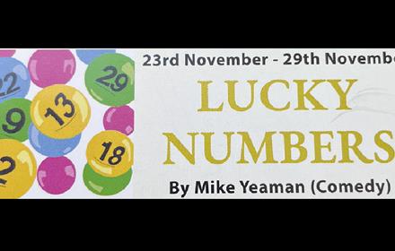 Lottery balls, text reads, 'Lucky Numbers', by Mike Yeaman (comedy)