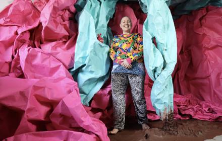 Disabled sculptor and Drag King Lady Kitt in colourful clothing