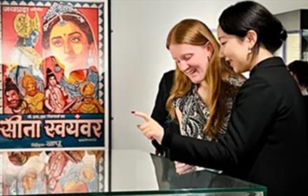 Two women looking at a display cabinet in the Oriental Museum.