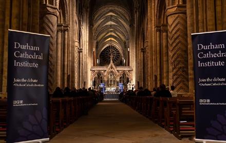 Speakers from Durham Cathedral Institute debate to an audience in the nave.