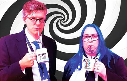 Emma Crossland & Sam Wilkinson drinking from mugs with swirly straws, standing against a swirly background.