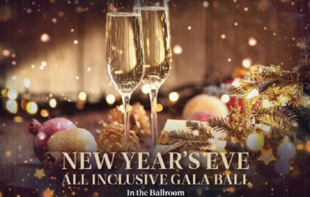 Champagne flutes, twinkly fairy lights and festive table decorations for the New Year's Eve All Inclusive Ball