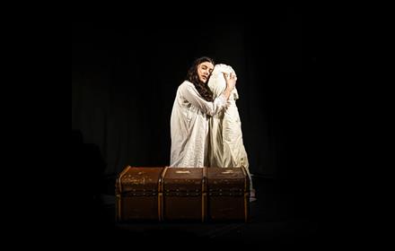 Actress portraying a Victorian woman in despair.