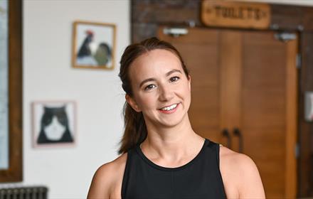 Yoga instructor smiling.