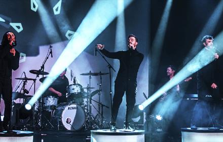 'Re-Take That' performing on stage