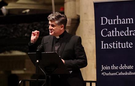 Vicar delivering a talk at Durham Cathedral