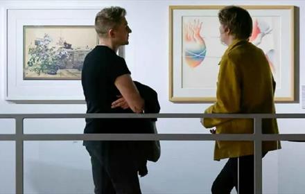 2 people admiring artwork