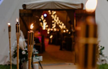 Lumley Castle Tipi softly lit with candles and fairylights