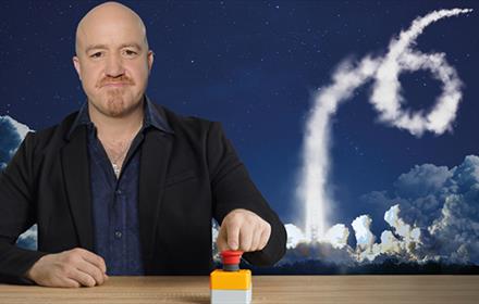Any Parsons pressing a button with an image of a rocket launching into space behind him