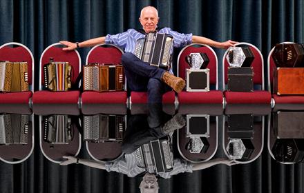 John Kirkpatrick with his array of squeeze boxes.