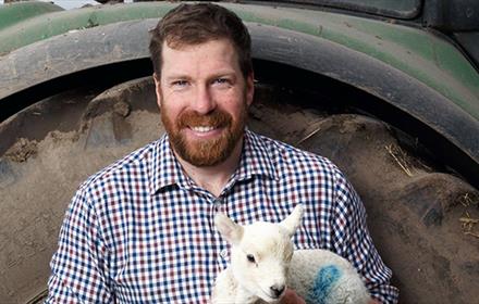 Jim Smith holding a lamb