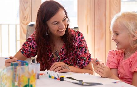 VE Celebrations family crafts - a woman and a child enjoying activities