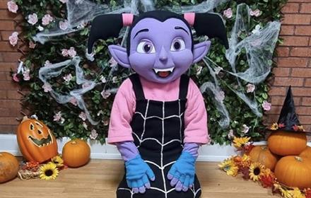 Vampirina character surrounded by pumpkins