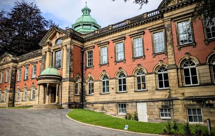 A view of the exterior of Redhills Durham Miners Hall on a sunny day.
