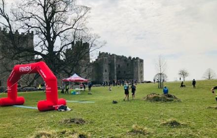 People partaking in a run in the grounds of Raby Castle.