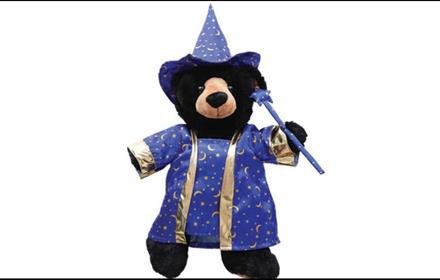 A teddy bear dressed as a wizard